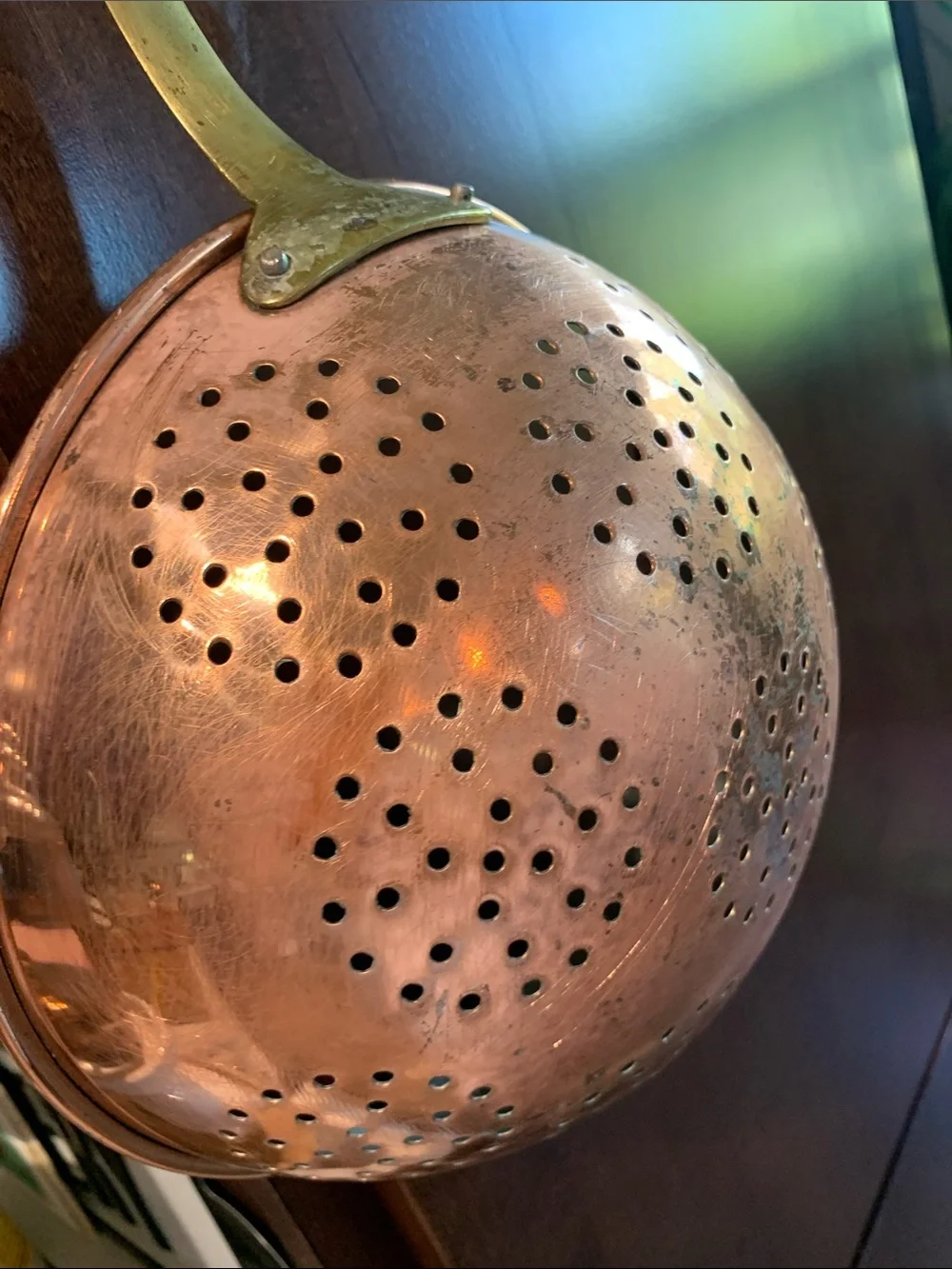 vintage copper colander strainer with a long brass handle 16”L